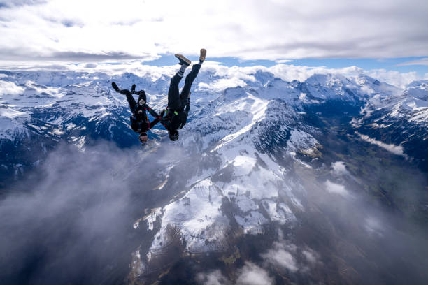 istock Freefall jumpers face each other mid-air 2149083944