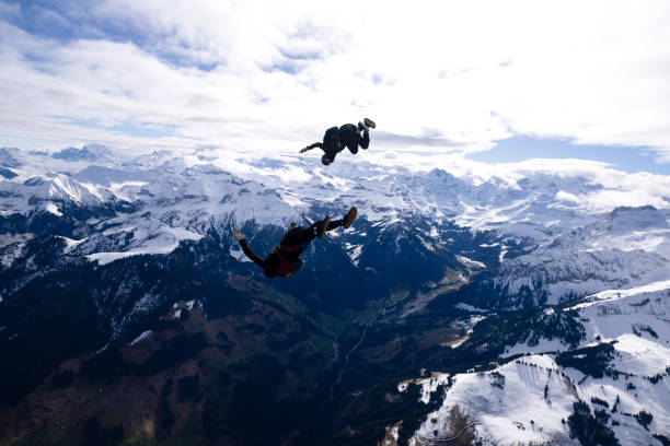 istock Freefall jumpers face each other mid-air 2149083989