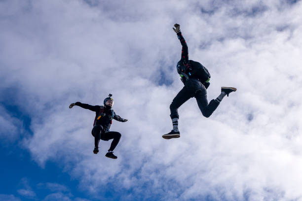 istock Freefall jumpers face each other mid-air 2149083990