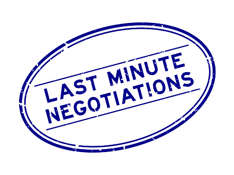 Grunge blue last minute negotiations word oval rubber seal stamp on white background
