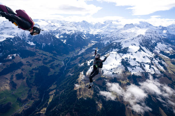 istock Freefall jumper and wingsuit flier mid-air 2149084229