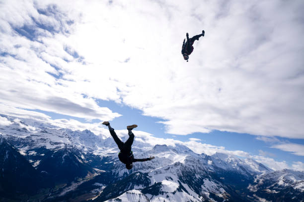 istock Freefall jumpers face each other mid-air upside down 2149084232