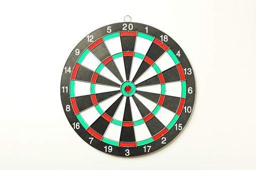 Target, dartboard, hitting the center. On a light background