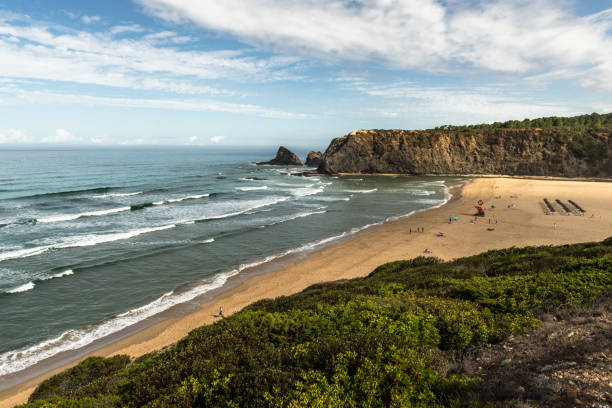 istock Atlantic Ocean, rocky cliffs and sandy beach in Portugal 2149084640