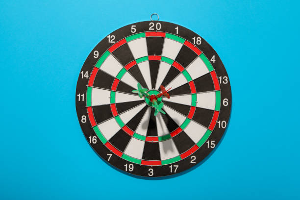 Dart board with wires in the target, on a blue background