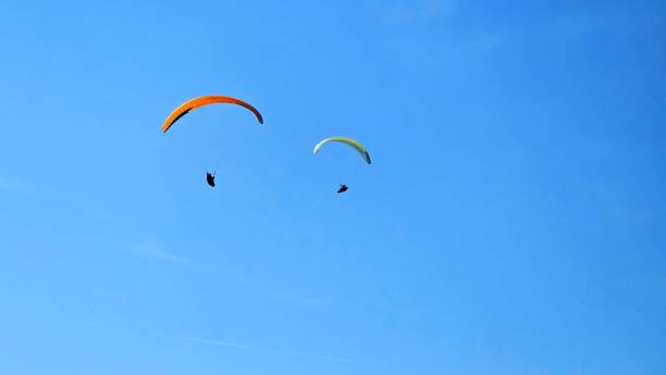 istock Paraglider flying above the sea 2149086234