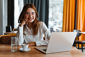 Cute Smiling Female Data Scientist Enjoying Her Coffee Break During Work Time