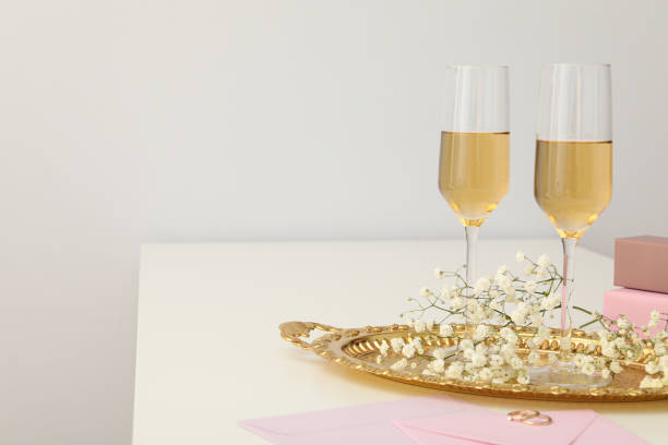 istock Glasses with wine, envelopes and wedding rings on white background, space for text 2149087257