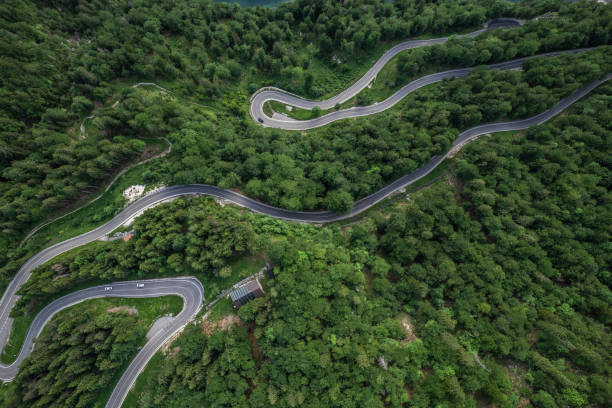 istock Curvy road in Slovenia Mountains, top down drone aerial view 2149087692