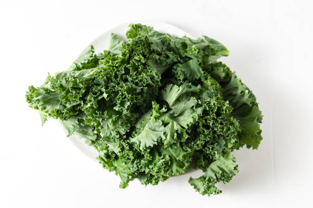 istock A bunch of fresh kale leaves on a white background. 2149087942