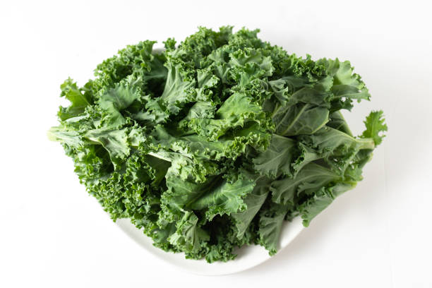 istock A bunch of fresh kale leaves on a white background. 2149087960