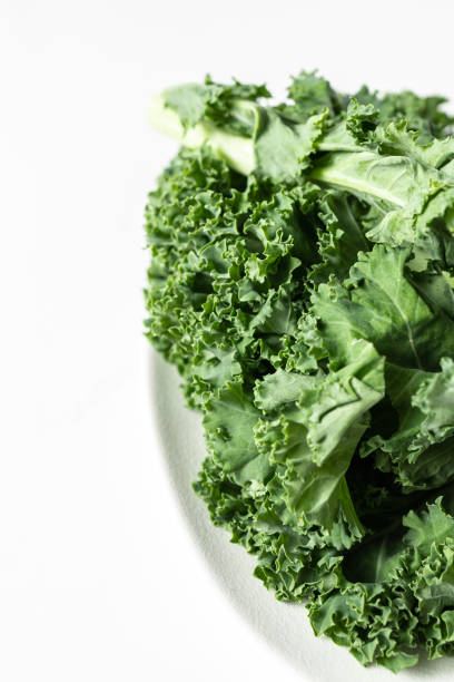 istock A bunch of fresh kale leaves on a white background. 2149087964