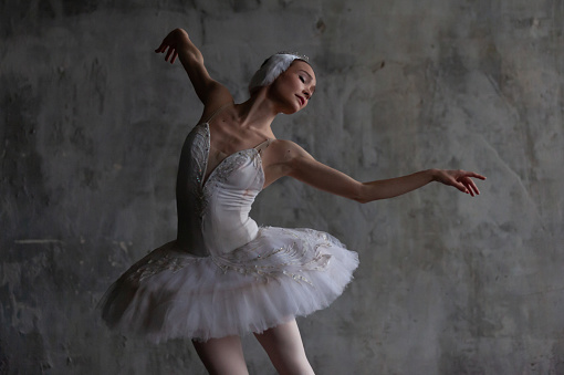 Ballerina performs the role of the white swan from Tchaikovsky's ballet.