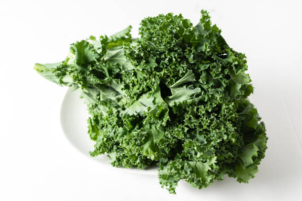 istock A bunch of fresh kale leaves on a white background. 2149088318
