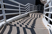 Reinforced concrete staircase with metal handrails