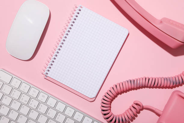 istock Vintage phone, keyboard and notepad on pink background, top view 2149091218