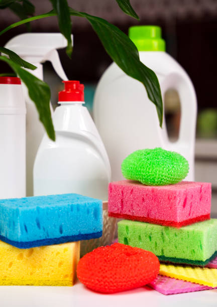 istock Various detergents and cleaning products, kitchen rags and sponges on the table in the kitchen. Spring cleaning concept. Close-up. Selective focus. 2149091481