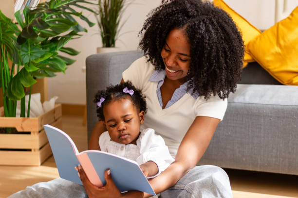 istock Mother reading to baby at home 2149091580
