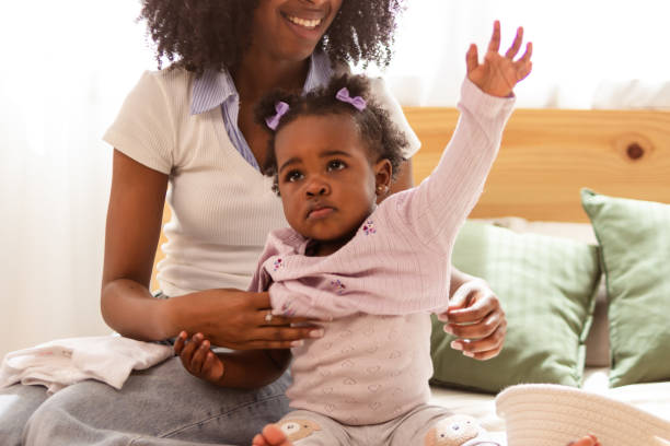 istock Joyful mother and baby playing at home 2149091817