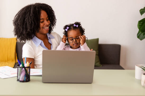 istock Mother and daughter enjoying time together using laptop 2149091839