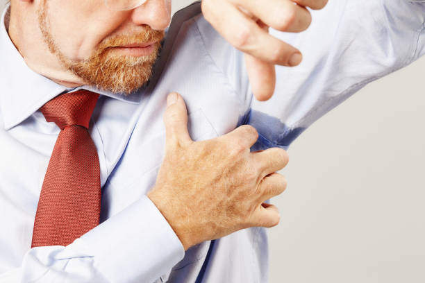 istock Man is disturbed to discover he has a sweaty armpit 2149092263