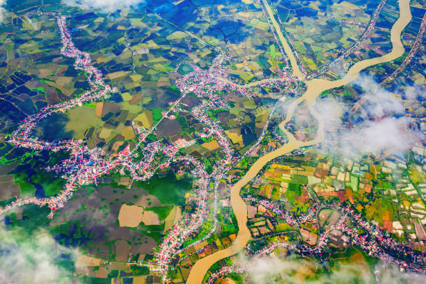 Manila suburb with small houses and rice fields aerial panoramic view from the plane, Philippines