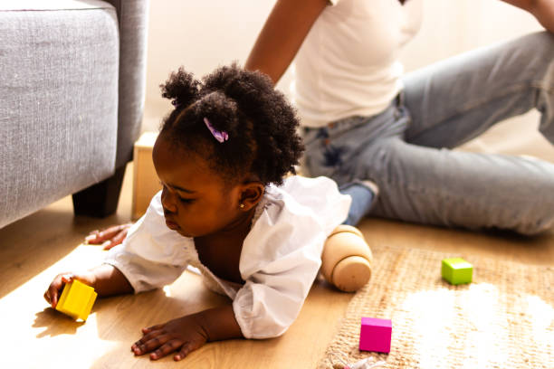 istock Toddler girl playing with blocks at home 2149092391