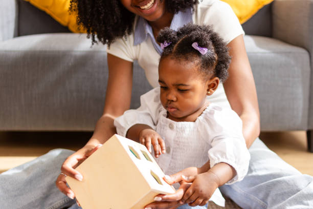 istock Mother and child playing together indoors 2149092550