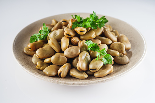 delicious Turkish snack boiled broad beans fava on a white background