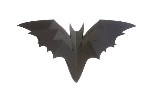 Black Bat Toy Over White Background