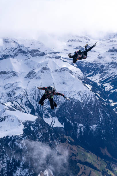 istock Freefall jumpers face to face in mid-air 2149093793