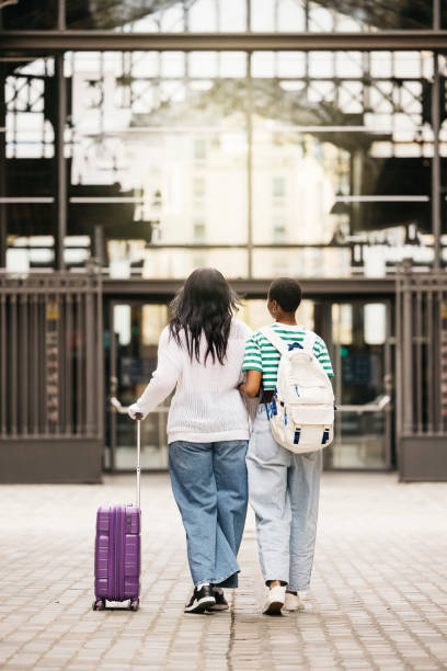 istock Two women walking on the street with a suitcase. 2149093902