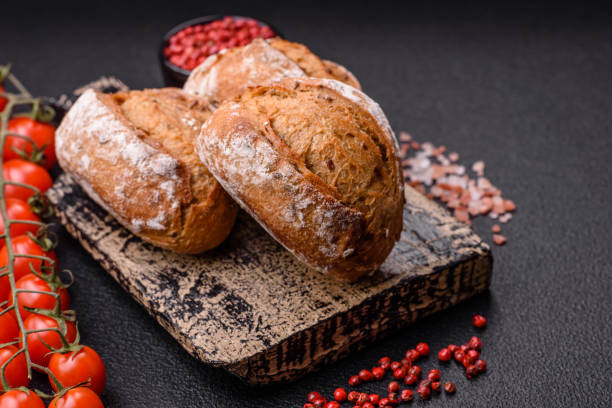 istock Fresh baked bread buns with salt, spices, seeds and grains 2149094163