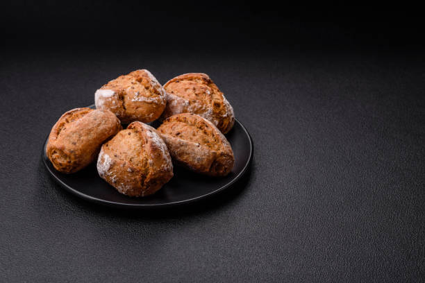 istock Fresh baked bread buns with salt, spices, seeds and grains 2149094164