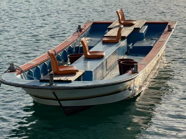 istock Fisherman boat on the sea at the sunset golden reflection 2149094680