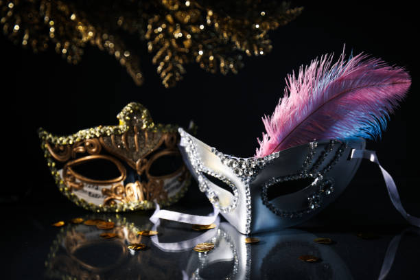 istock Carnival masks and feather on black background 2149096255