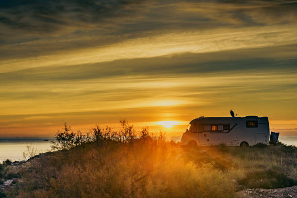 istock Caravan on sea at sunrise. 2149096373