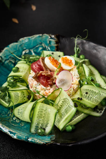 istock Gourmet Olivier Salad with Roast Beef and Fresh Cucumbers on Elegant Plate 2149097381