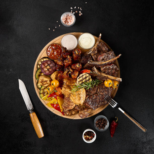 istock Diverse Grilled Meat and Vegetable Platter with BBQ Ribs, Lamb, Beef, Turkey, and Chicken 2149097597