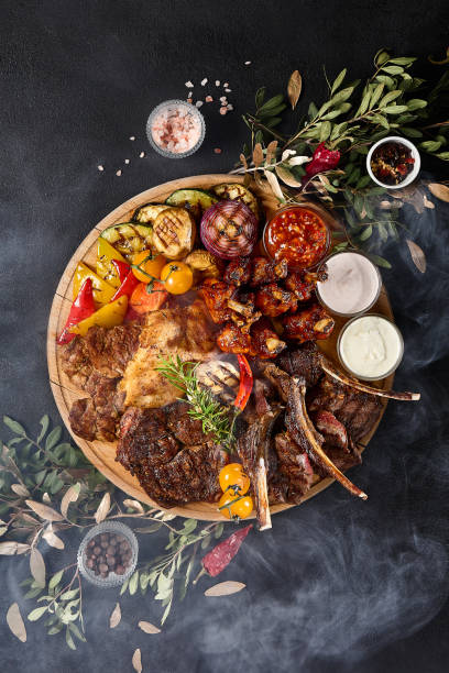 istock Sumptuous Grilled Meat and Vegetable Assortment on a Barbecue 2149097603