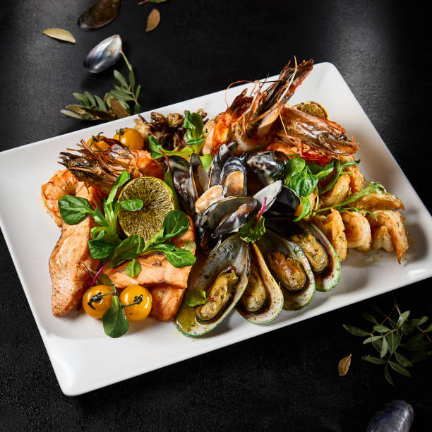 istock Gourmet Seafood Platter Featuring Mussels, Salmon, Shrimp, and Octopus on Elegant Dining Table 2149097618