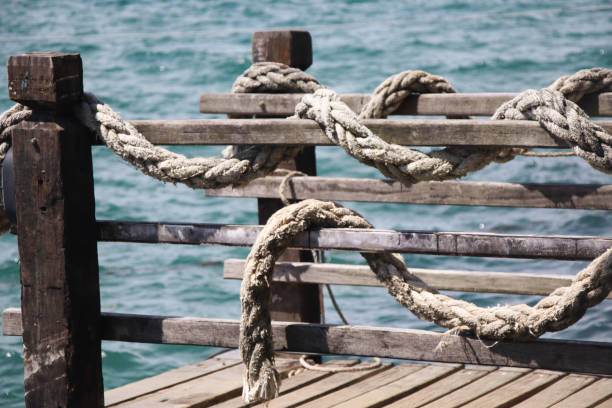 nautical rope wrapped around a wooden bridge