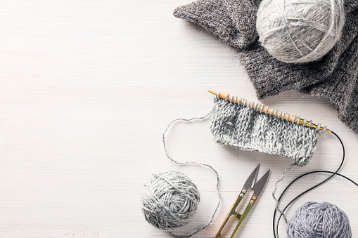 Cold season cozy hobby, concept of hobby - knitting