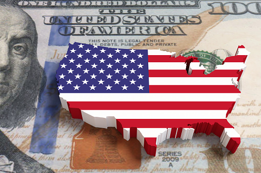 Toy block of USA map on a US dollar banknote. Illustration of the concept of United States (US) monetary policy and American financial crisis
