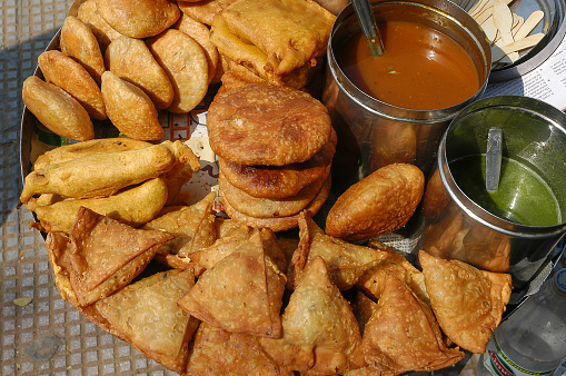 Tray with sambasa and other typical specialties in India