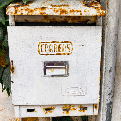 Very high resolution 3D rendering of an open mailbox with a letter arriving.