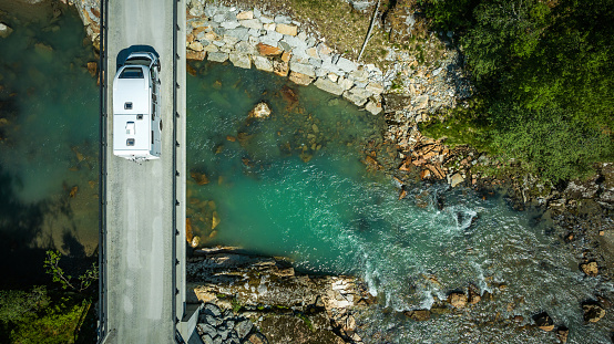 Modern Camper Van on a River Bridge Aerial Photo. Norwegian Scenic Drives