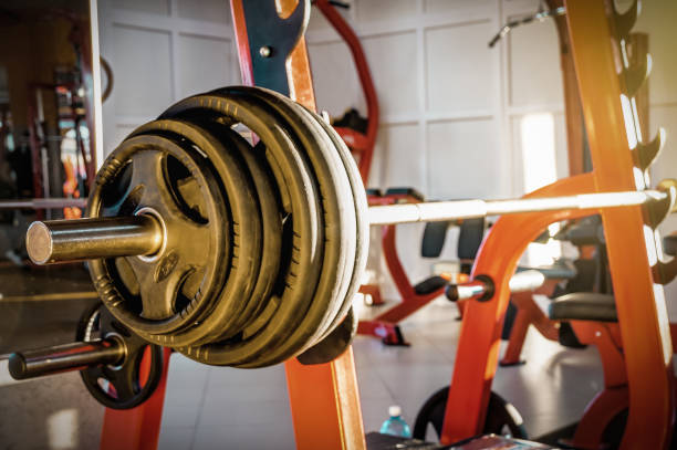 istock Barbell in the gym. Weigh lifting. Bench press 2149100370