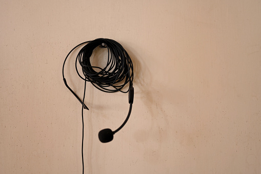 The reel of headphones hanging