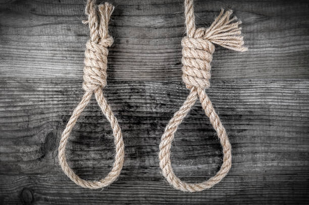 istock Two rope with noose for suicide on wooden background 2149101678